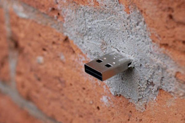 USB Drive in a brick wall.