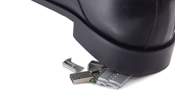 shoe stepping on usb drive.