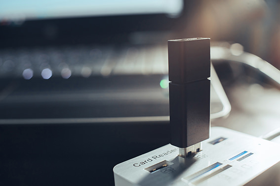 USB Drive plugged into a usb hub, connected to a laptop.